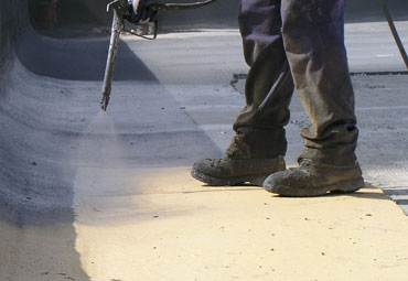 Coating systems over Harrisburg spray foam roof systems